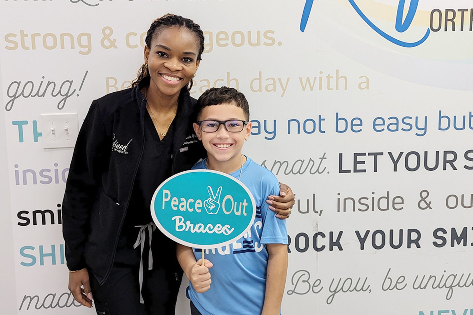 A finished-treatment celebration at Refined Orthodontics