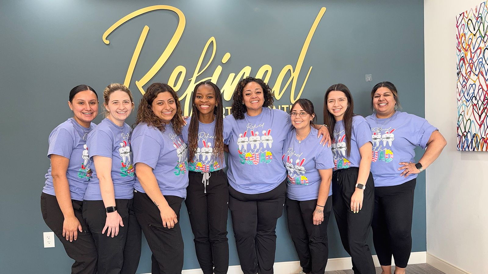 The Refined Orthodontics team at the office sign