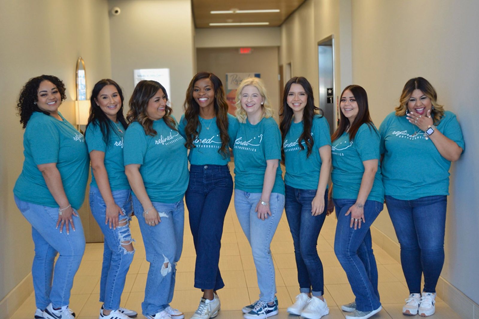Refined Orthodontics team members in the office hallway